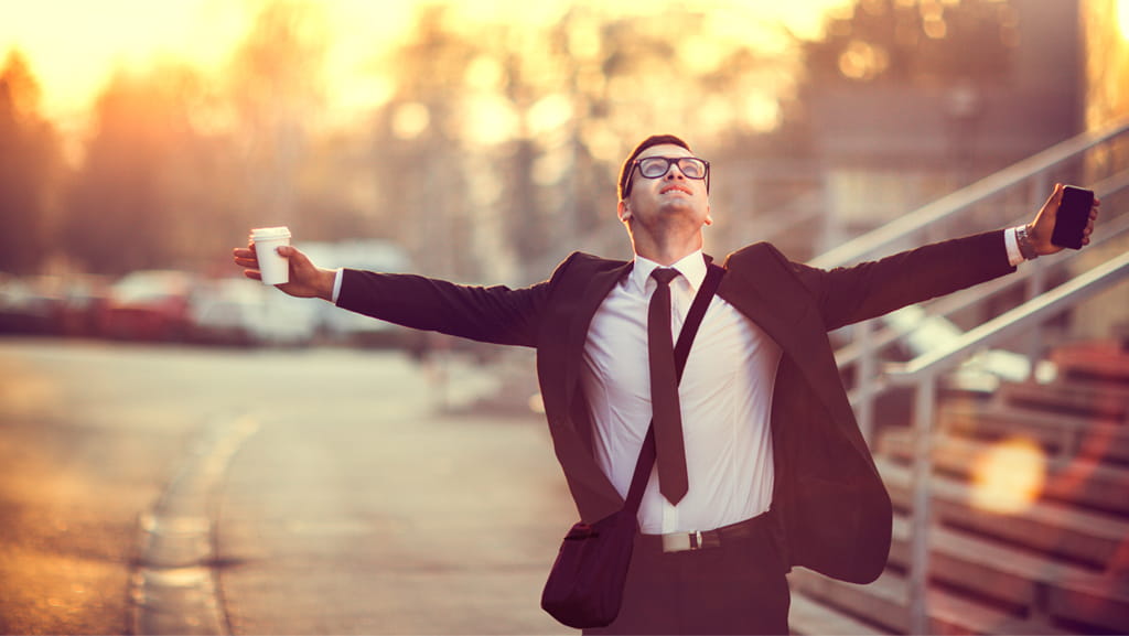 Business person with coffee and a cellphone