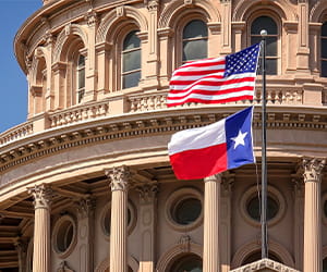 government building with US national flag and Texas state flag