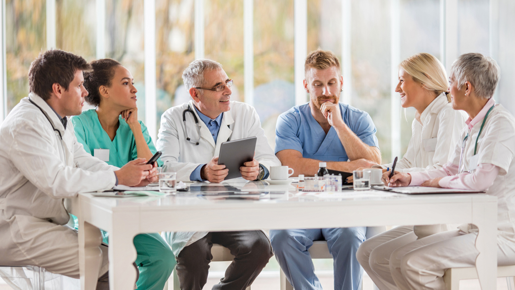 Medical staff sitting at a table