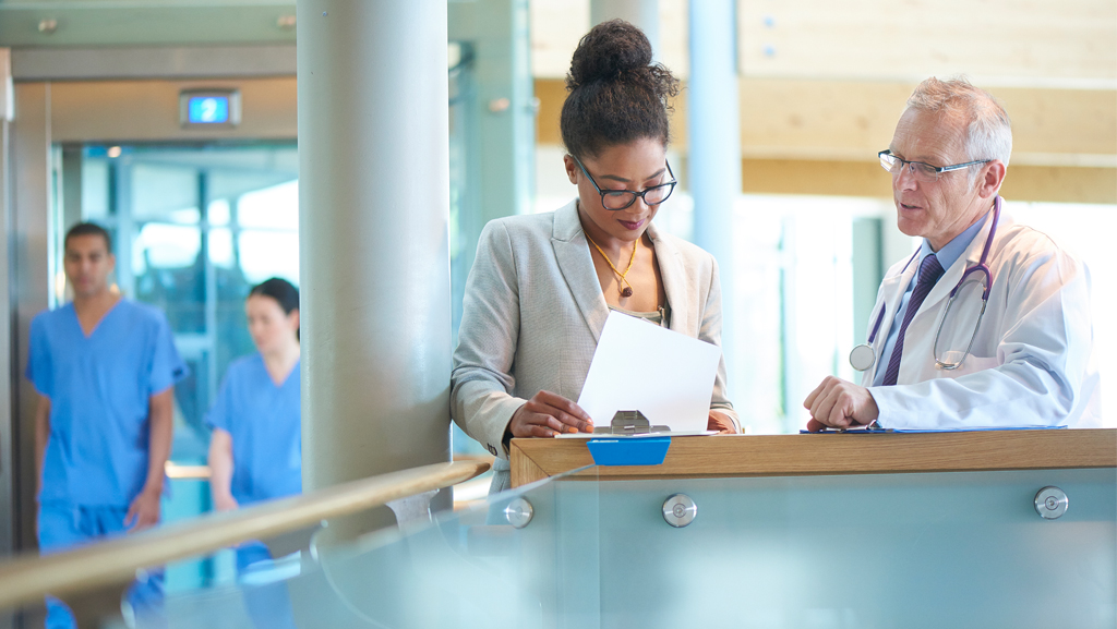 Two medical staffers in discussion
