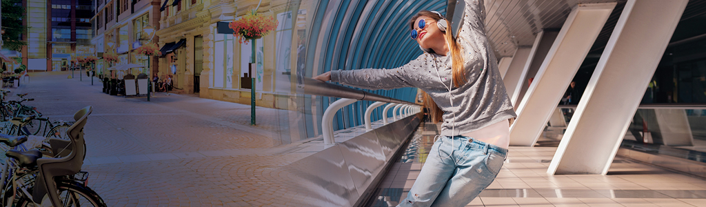 woman dancing down a building hallway