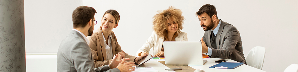 colleagues having a work discussion on a table