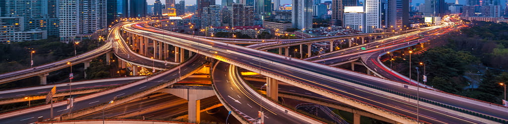 flyover highways leading to a city with high-rise buildings