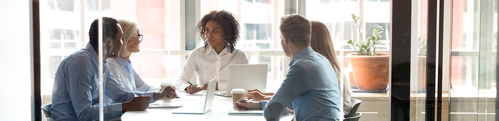 tax team working around a table