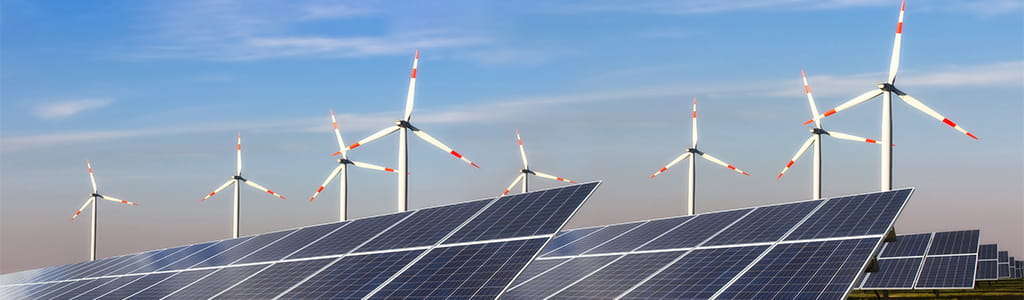 solar panels and windmills illustrating renewable energy