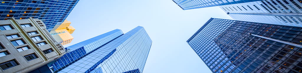 ground upward view of tall buildings in blue