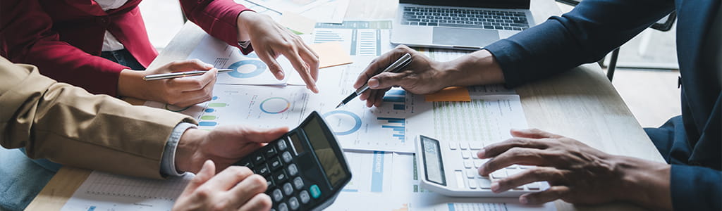 hands around tax documents