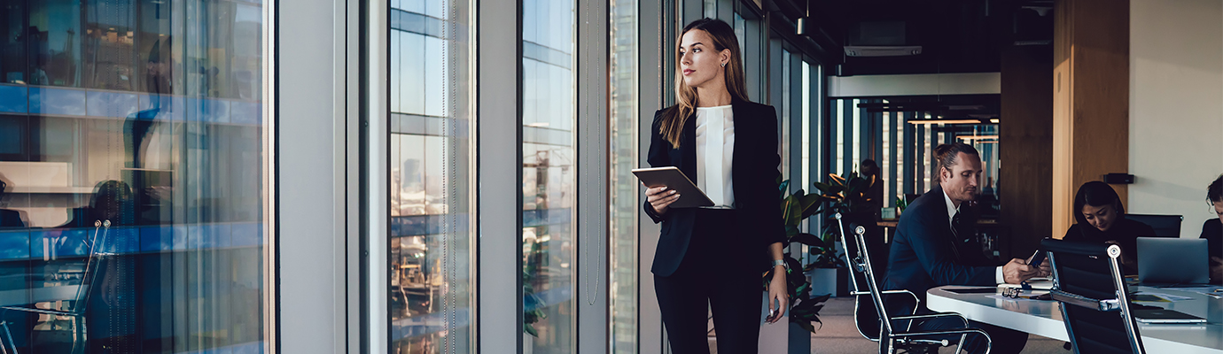 a woman walking the halls of an office