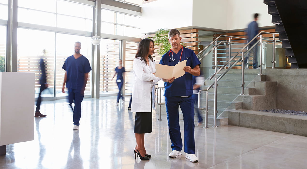 two medical employees in a healthcare setting