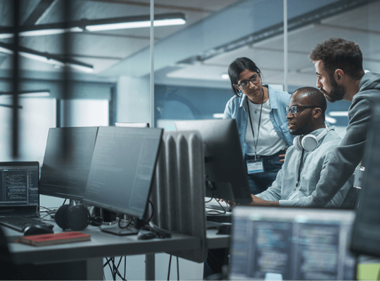 coworkers solving a problem at a desk