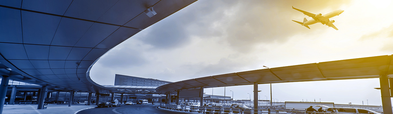 external view of an airplane flying out of an airport