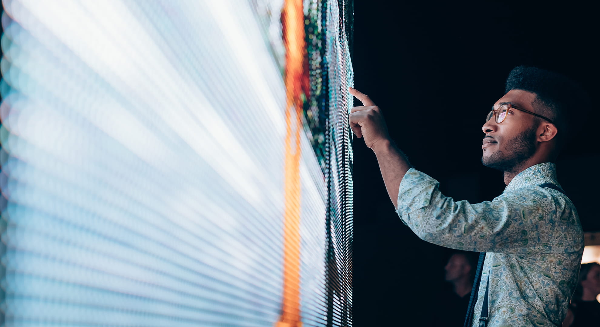 man touching a screen