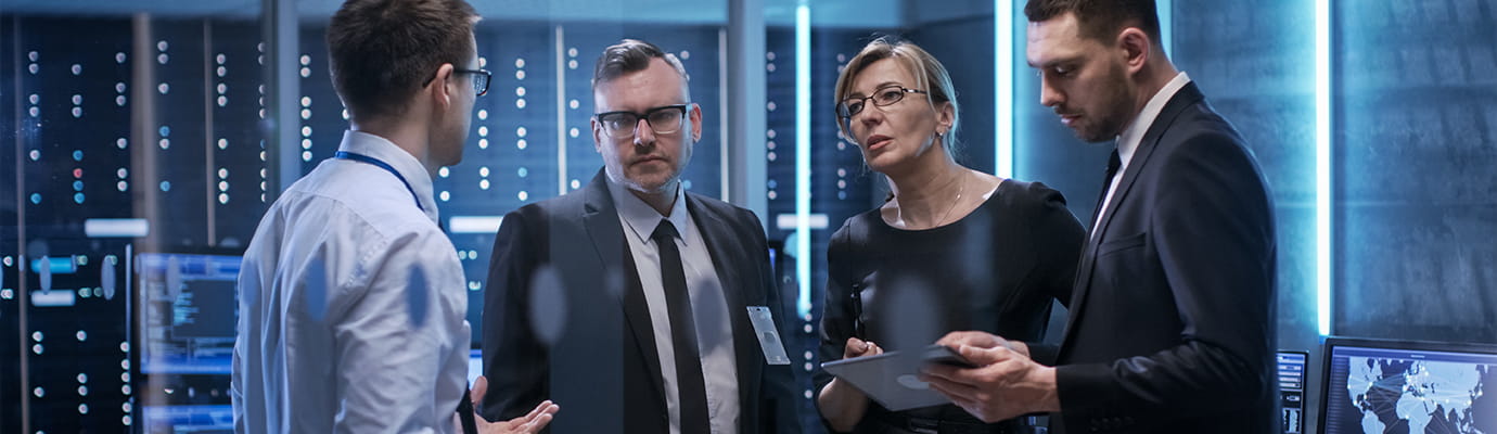 employees having a discussion in a cybersecurity cmmc work setting