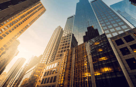 upward shot of a building at sunset