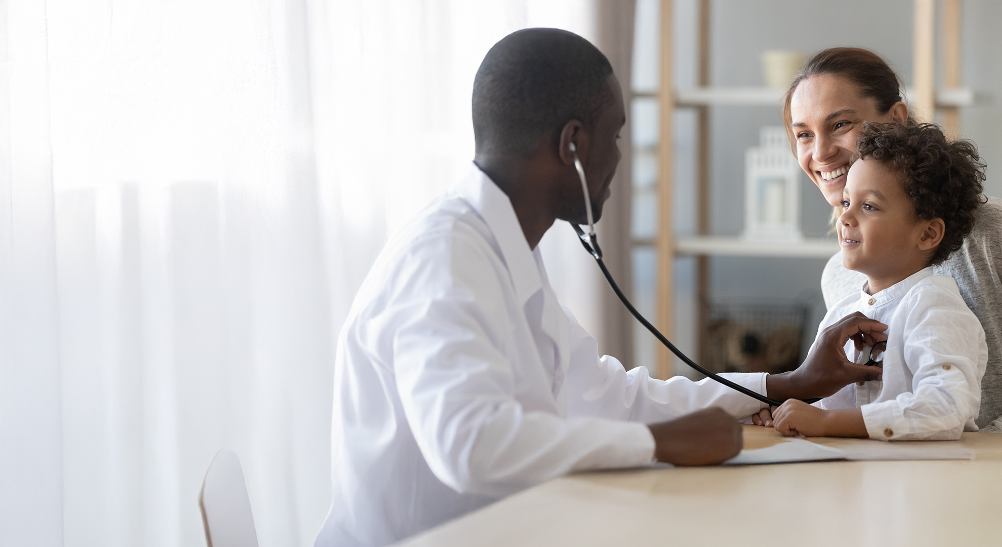 a doctor checking a child with mother