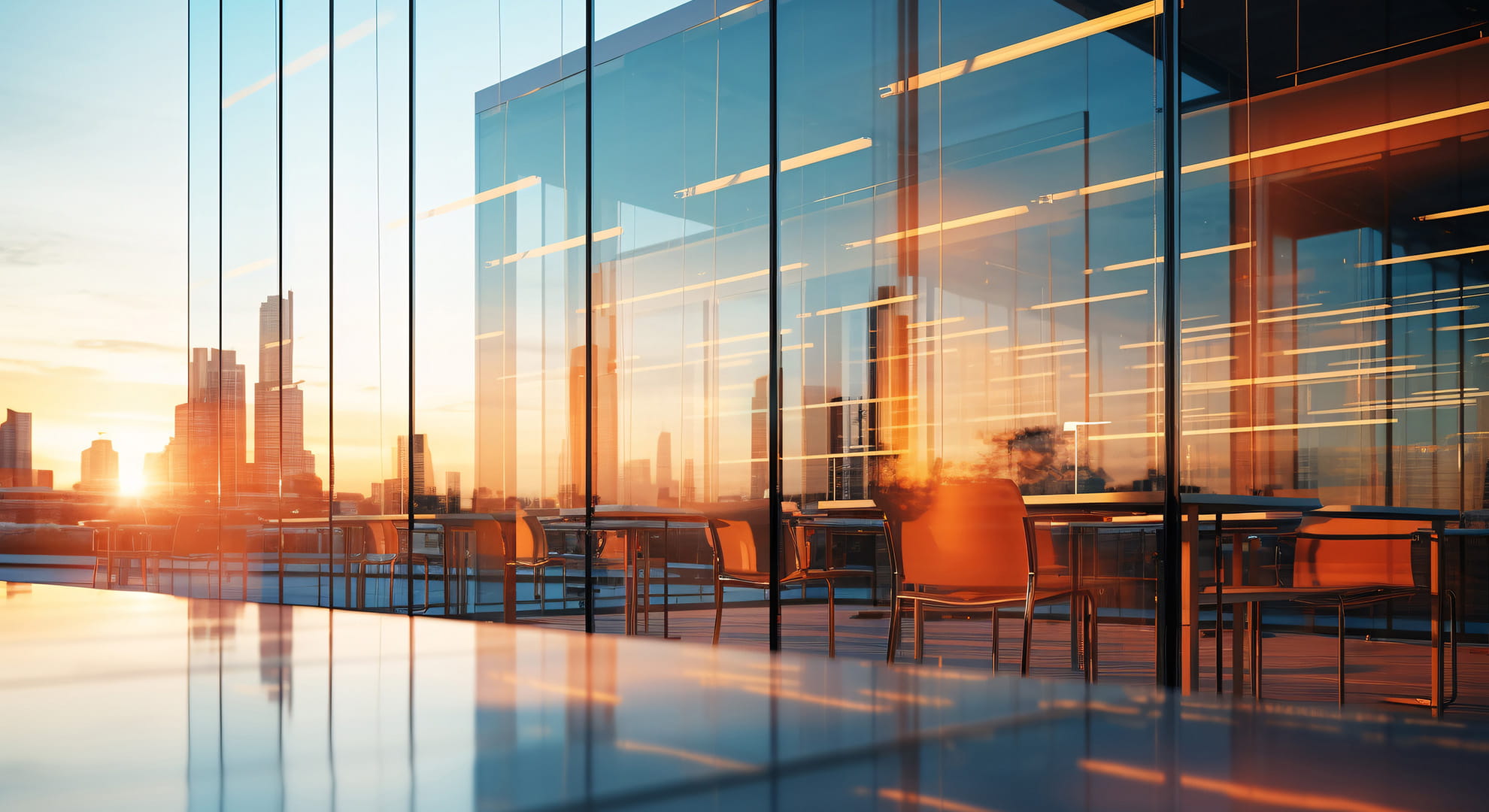 exterior of a glass building at sunset