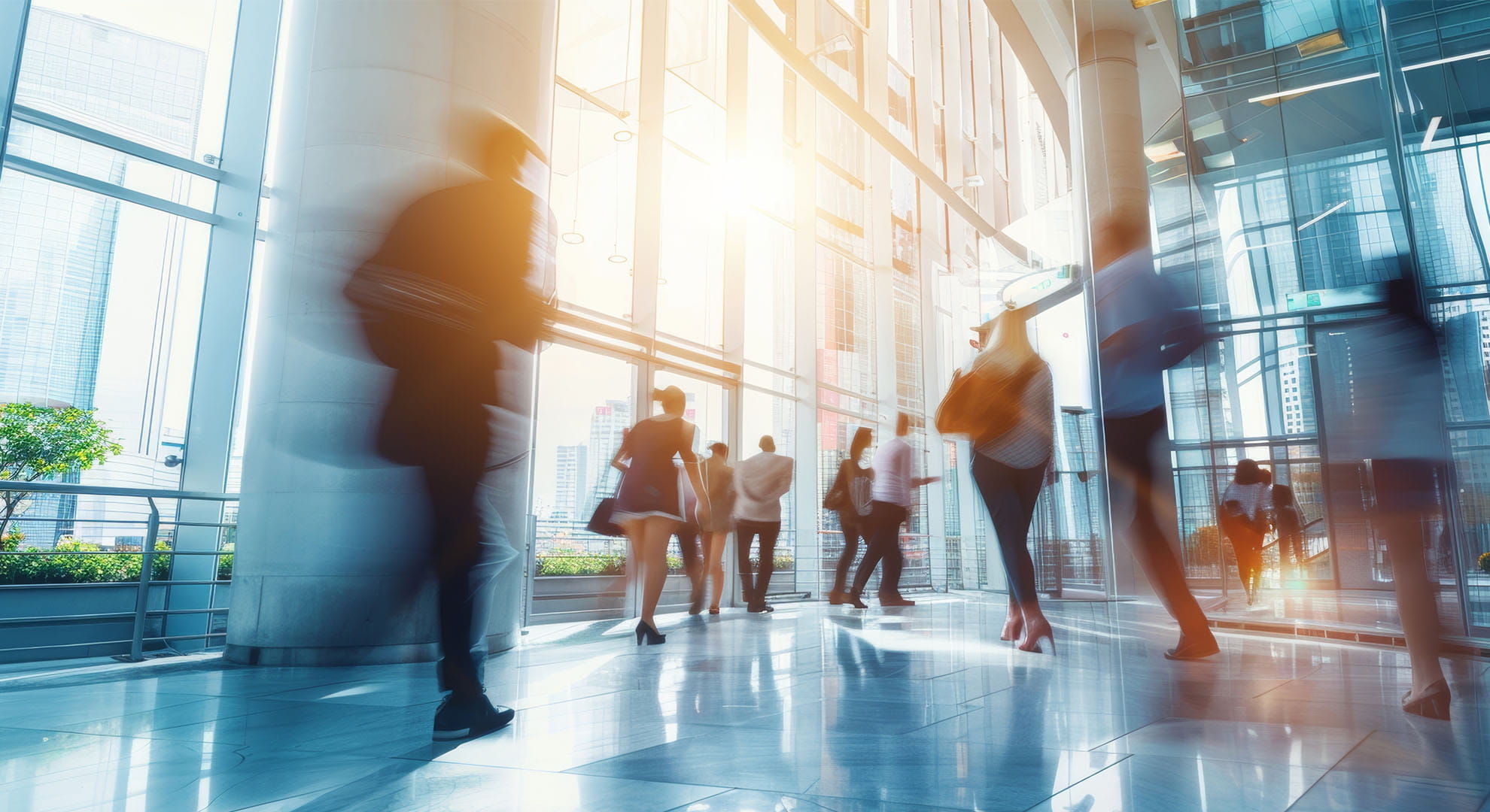 people walking out of a corporate building