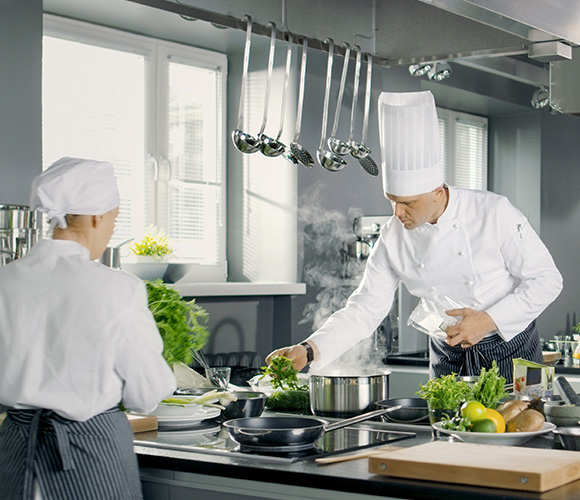 Chefs cooking in kitchen