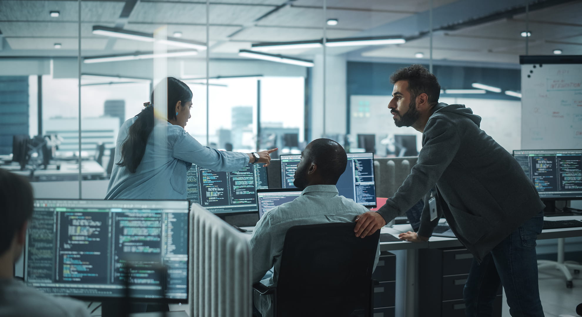 a team of cybersecurity experts reviewing a challenge