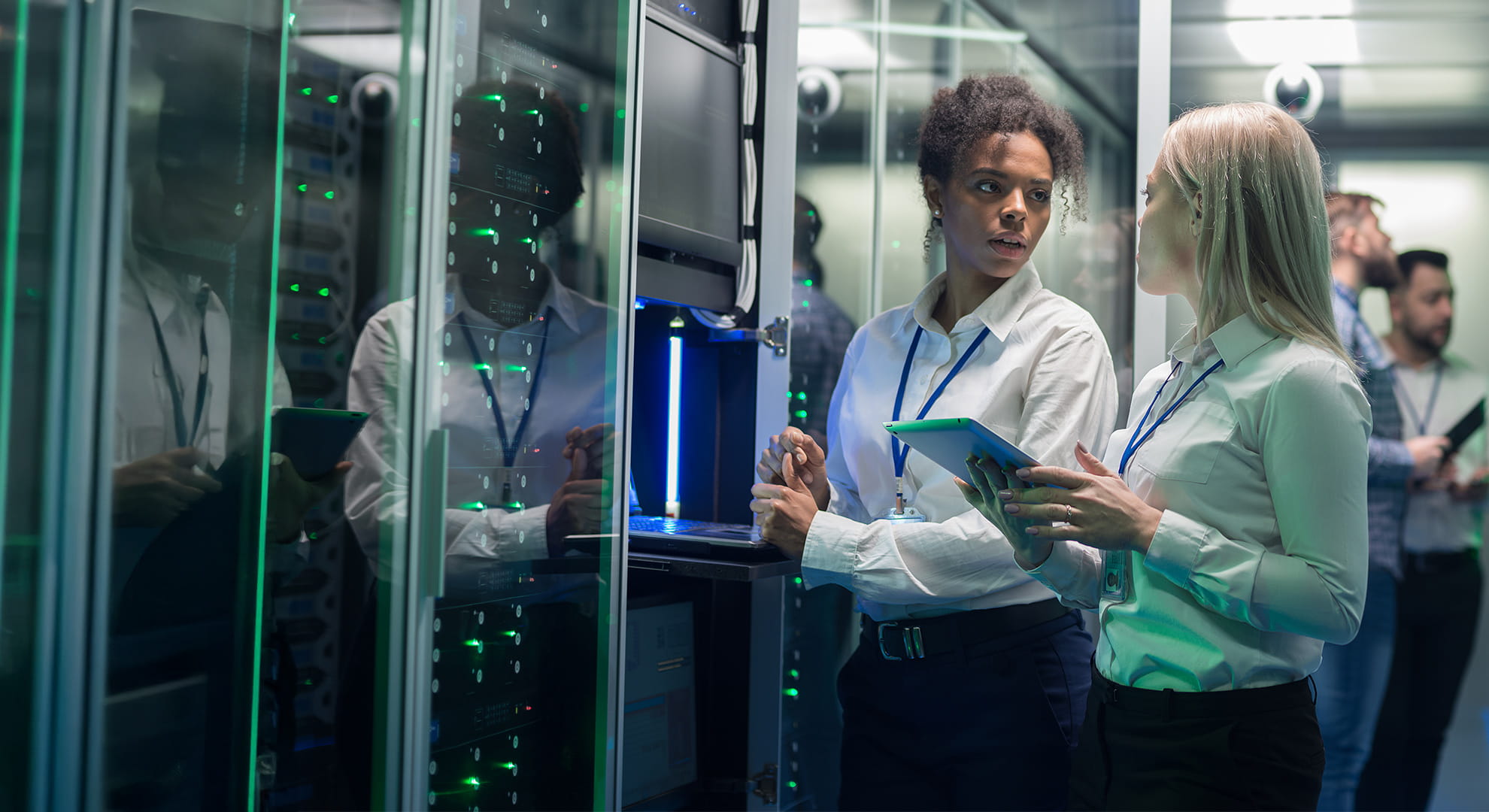 a cybersecurity teamworking together near a server