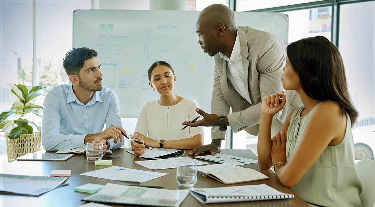 people having discussion in a boardroom