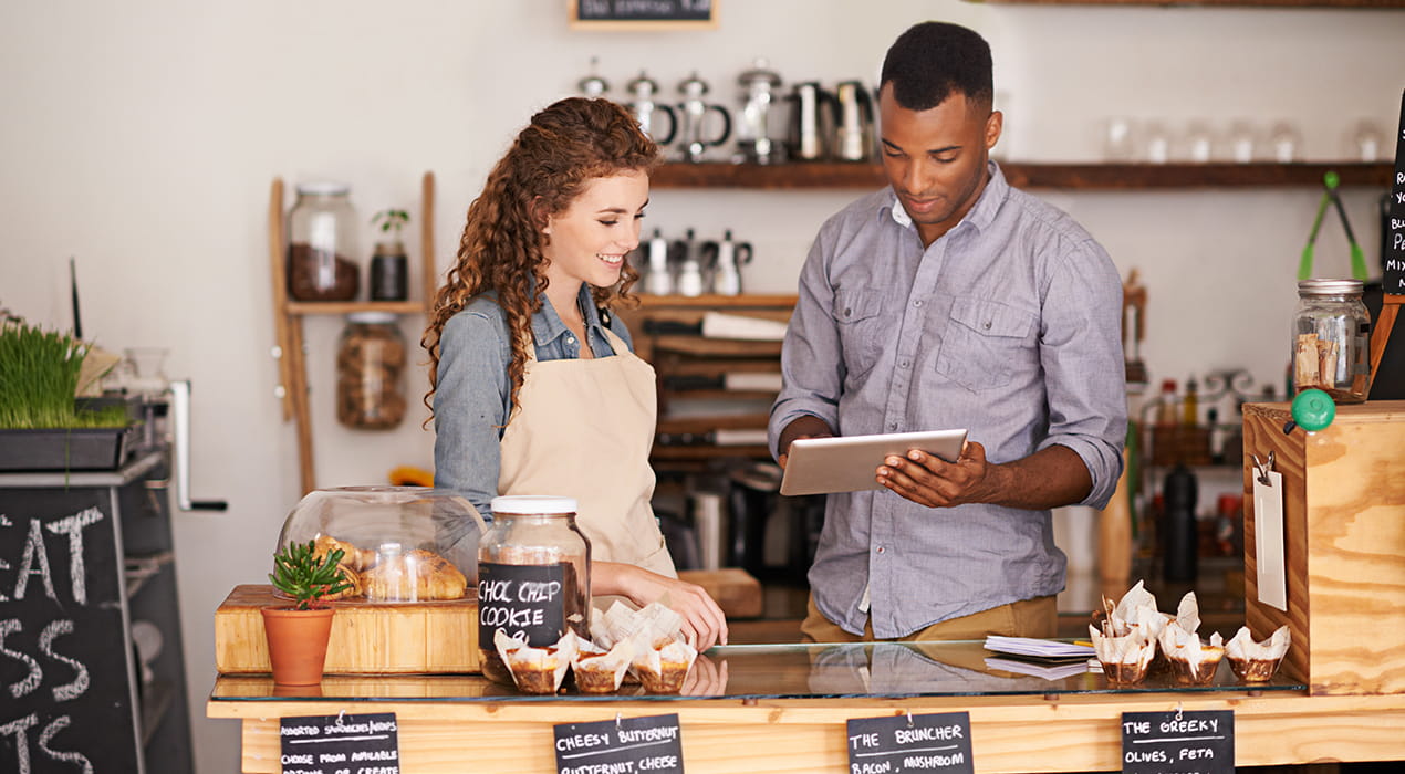 2 workers in a restaurant setting