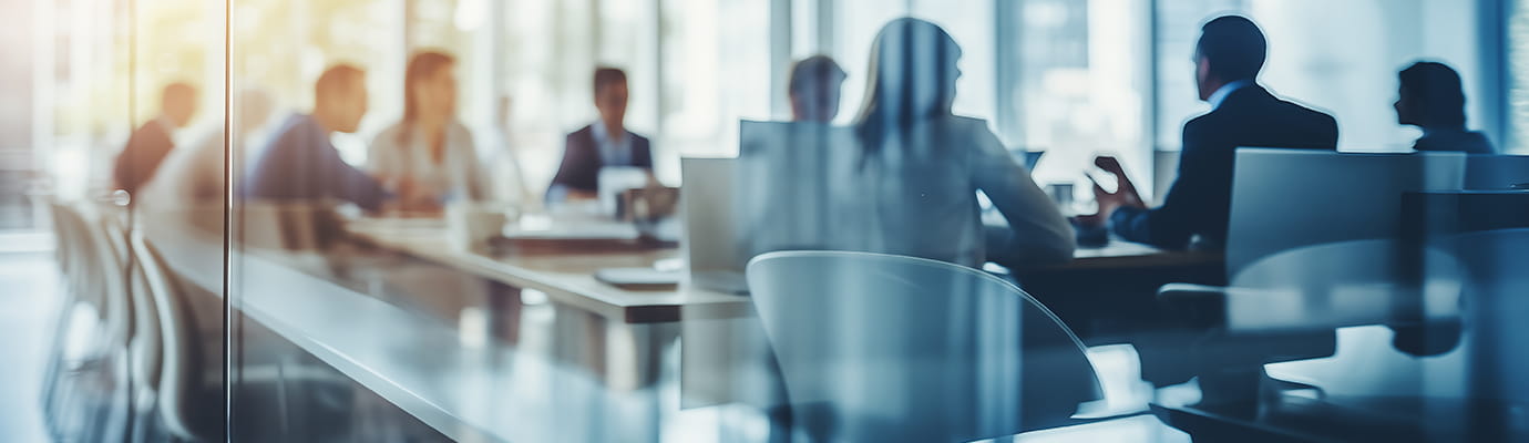 a team in a glass conference room