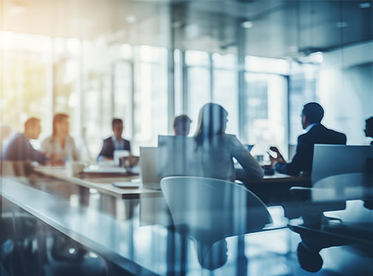a team in a glass conference room