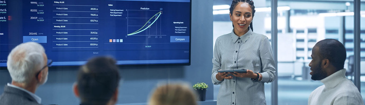 a business meeting looking at anayltics