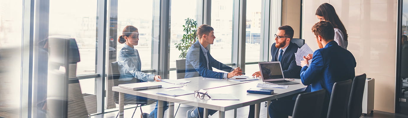 Office colleagues discussing in meeting room