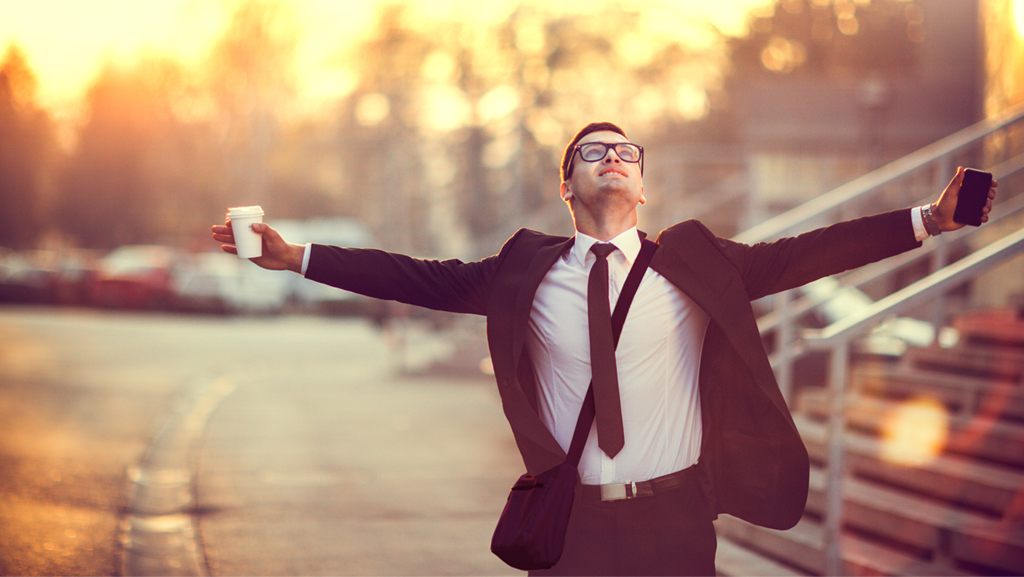 Business person with coffee and a cellphone